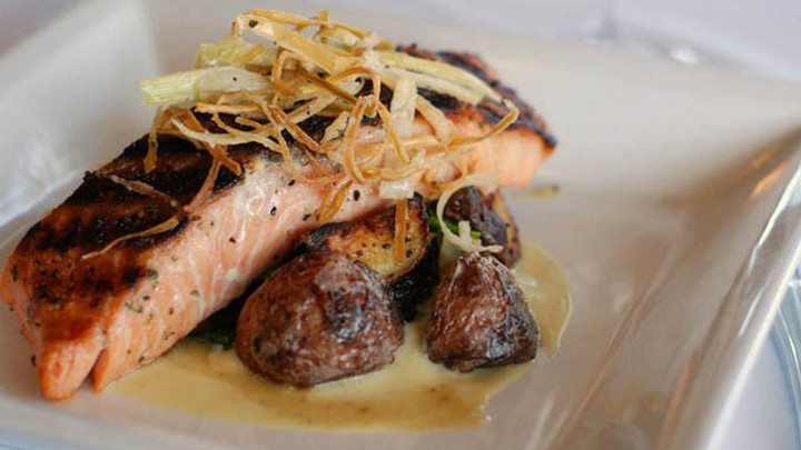 Columbia Saluda's salmon on a dish with potatoes