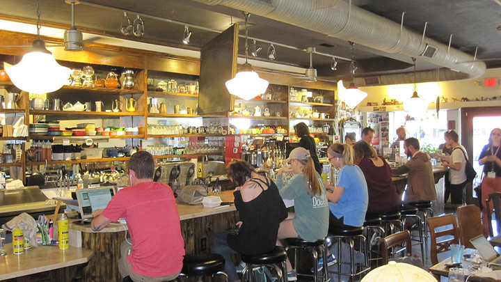 People eating and drinking coffee at Drip 