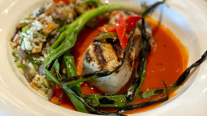 Fish, rice, vegetables in broth