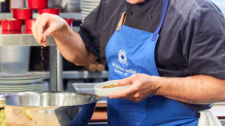 Chef Dall'Erta preparing food in the kitchen